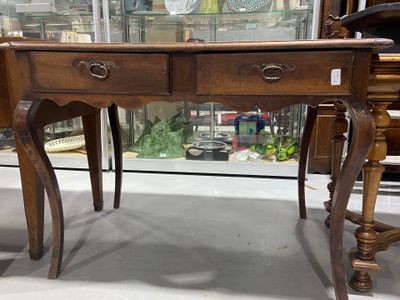 a wooden table with two drawers and a glass top