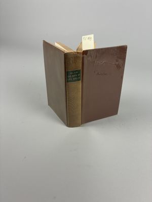 an open book sitting on top of a table next to a white background