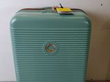 a blue suitcase with a tag on it