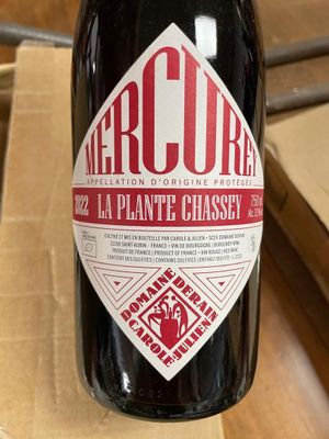 a bottle of wine that is sitting on a table
