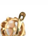 an image of a close up of a ring on a white surface