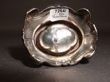 a silver object with a label on it on a table