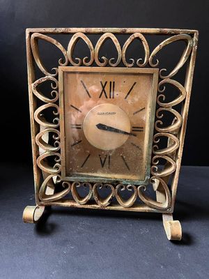 a small clock that is sitting on a table