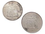 two silver coins with the image of a man and woman on them