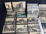 several old black and white photographs of buildings and buildings on a table