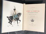 an open book with a drawing of a man on a horse