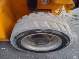 a tire on the back of a construction vehicle
