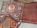 several rugs are laid out on the floor in a room