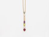 a gold necklace with multi colored stones and pearls
