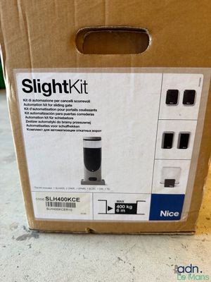 the box is open on the floor with the contents in it