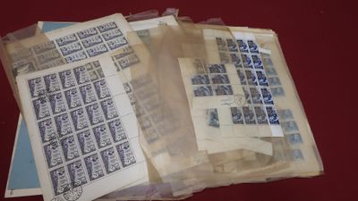 a pile of stamps sitting on top of a table