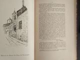 an open book with a drawing of a building on it