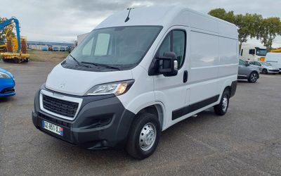 a picture of a white van parked in a parking lot