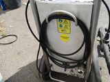 a white machine that is sitting on the ground