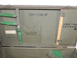 a green suitcase that has some writing on it
