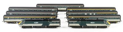 four trains that are sitting next to each other on the tracks