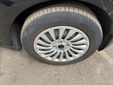 a close up of a car ' s tire on the pavement