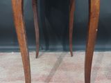 an old wooden table with a drawer on top of it