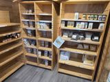many shelves in the store that have various items on them