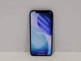 the back of a black iphone x sitting on top of a white table