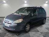 a picture of a black minivan parked in a garage