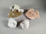 trois types de roches différents posés sur une table avec un fond blanc