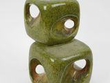 two green ceramic cubes stacked on top of each other