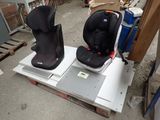 two seats that are sitting on top of a pallet