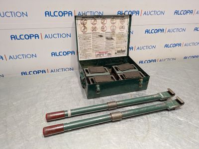 an image of a box with two tools in it on a table