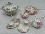 a table with a tea set and a tea pot on it