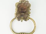 brass ring with a face of a lion on it ' s head