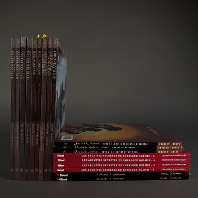 several books are stacked on top of each other on a table