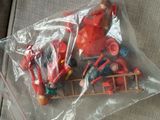 a plastic bag filled with toys on a couch