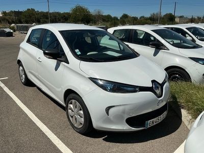 many white cars parked in a parking lot