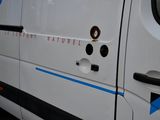 a white van with a blue stripe on the side of it