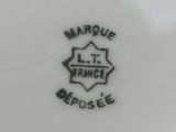 a close up of a plate with a logo on it