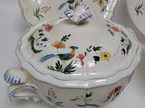 three bowls and a saucer on a white table