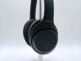 a close up of a pair of headphones on a stand