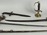 several different types of swords are displayed on a white surface