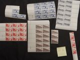 several stamps and envelopes are laid out on a table
