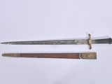 pair of old and worn swords on a white surface