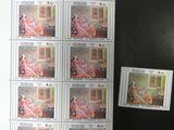 une photo d'une photo représentant une femme sur une feuille de timbres