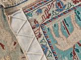 close up of a rug with fringes on top of it