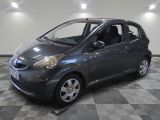a picture of a small car parked in a garage