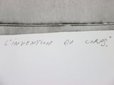 a piece of paper with writing on it sitting on a table