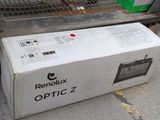 a box that is sitting on the ground next to a grill