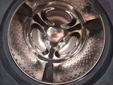 a close up view of a washing machine with the door open