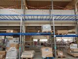 a large warehouse filled with lots of boxes and pallets