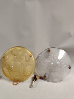 three glass vases sitting on top of a white table