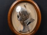 a picture of a bird in a picture frame on a wall